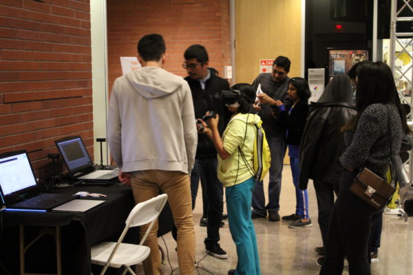This image shows a child using an Oculus Rift to try the Space Object VR experience.