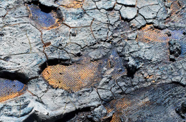A canvas spread with sand, cement paste, and acrylic and watercolor to create craters, peaks, and cracks reminiscent of the asteroid's surface. Soft whites, blues, and browns are layerered with gold and copper metal paint.