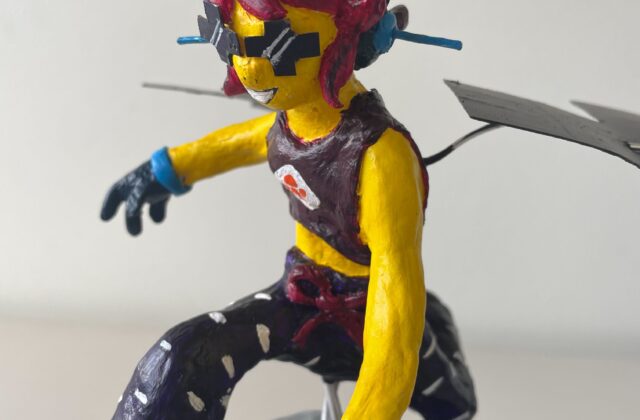 A clay sculpture of a skater girl, reimagining NASA’s Psyche spacecraft. She soars mid-air over the 16 Psyche asteroid, her rollerblades powered by hall thrusters. Sunglasses mimic solar cells, and sleek wings extend from her back. Painted in Psyche mission colors, the piece blends science and art, capturing the excitement of space exploration.